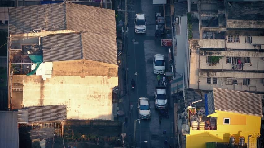 Road Through Poor Area Of City At Sunset