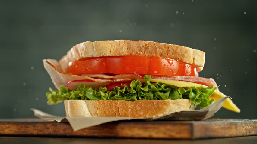 Super slow motion of stacking sandwich pieces. Camera in motion. Filmed on high speed cinema camera, 1000 fps. Placed on high speed cine bot. Speed ramp effect. | Shutterstock HD Video #1101654105