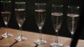 Glasses of champagne at the festival. Bubbles in sparkling wine. - Powered by Shutterstock - Get 15% off with code: PIKWIZARD15