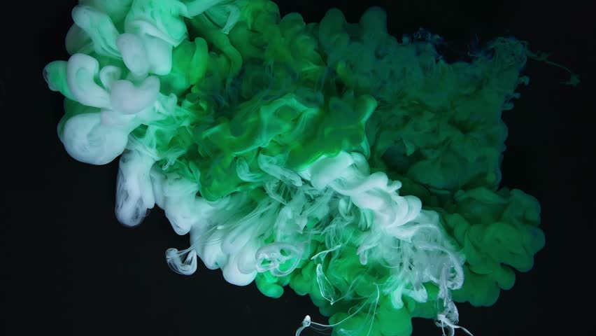 Colored Ink and Green and Yellow Paint Splash Creating Beautiful Abstract Display on a Black Background