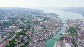 Inscription on video. Zurich, Switzerland. Panorama of the city from the air. View of Zurich Lake. Different colors letters appears behind small squares, Aerial View