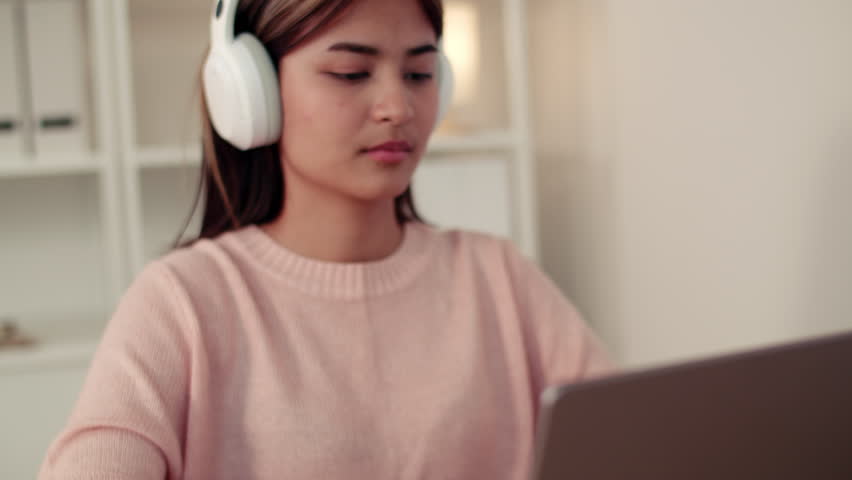 Woman wearing headphone listening to music 
