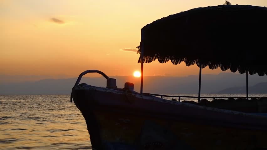 Tourist boat docked in Aqaba Jordan during sunset