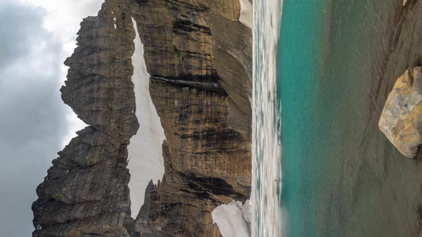 Vertical 4k Time Lapse, Glacial Lake, Ice Snow and Mountain Peak, Glacier National Park, Montana USA