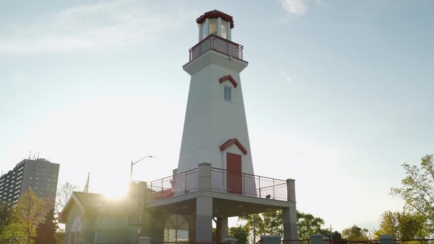 Close-up of a lighthouse at sunrise in a Mississauga harbor.