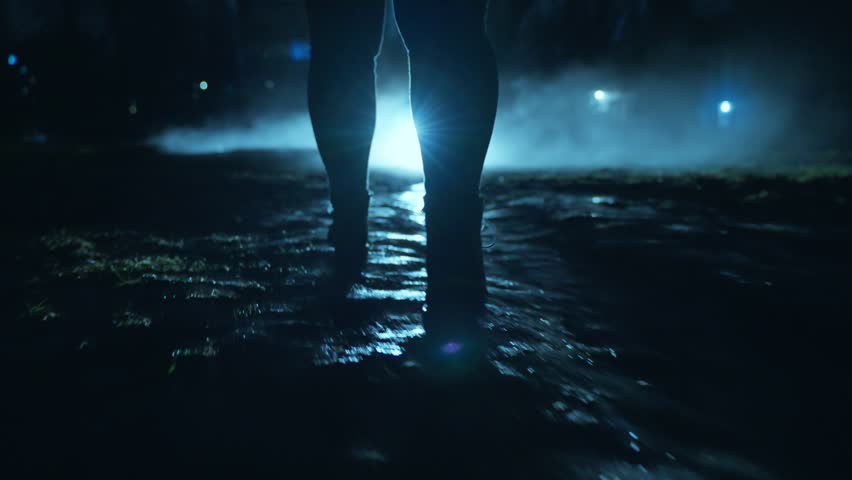 A people walking in the dark through the fog and darkness after the rain Royalty-Free Stock Footage #1101680533