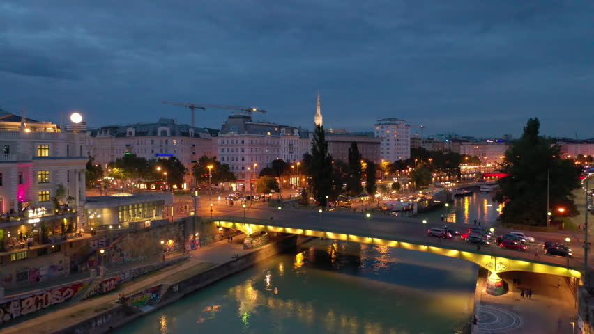 twilight time illumination vienna city famous riverside night life traffic bridge aerial panorama 4k austria