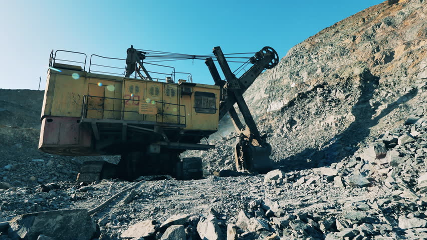 Industrial machine is excavating ore in the minery