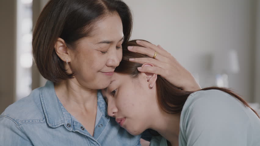 Middle aged asia people old mom love care trust comfort help young teen talk crying stress relief at home. Mum as friend listen adult child woman feel pain sad worry of broken heart life crisis issues Royalty-Free Stock Footage #1101685109