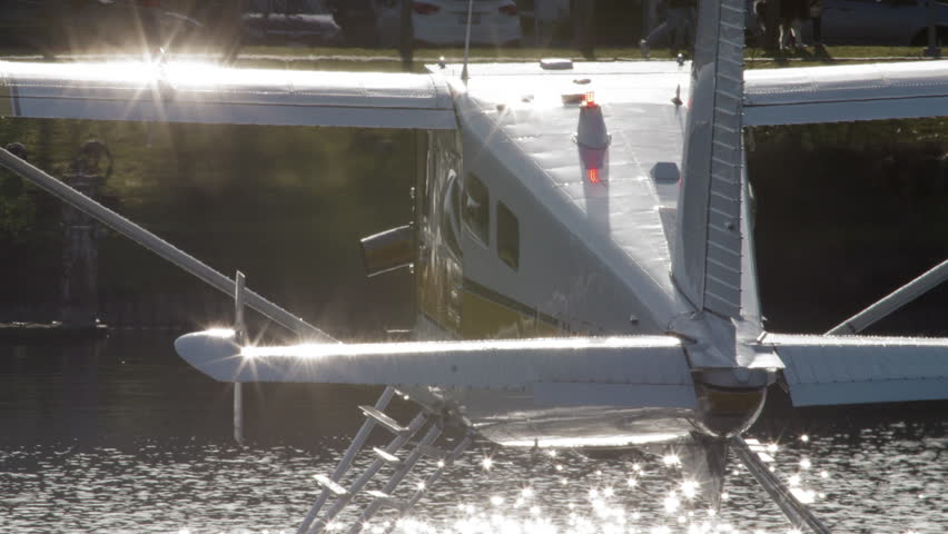 Seaplane Floating by on Lake Union in Seattle Washington. Cinematic Slow Motion View of Floating Airplane