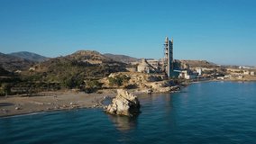 Aerial 4K video from drone to Penon del Cuervo beach, The Rock of the Raven and Playa la Fabrica cement factory. Malaga, Costa del sol, Andalucia ,Spain (series)