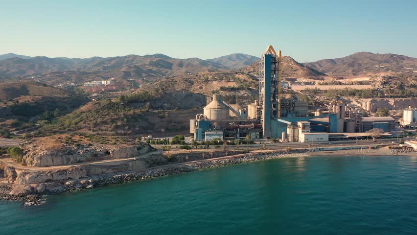 Aerial 4K video from drone to Penon del Cuervo beach, The Rock of the Raven and Playa la Fabrica cement factory. Malaga, Costa del sol, Andalucia ,Spain (series)