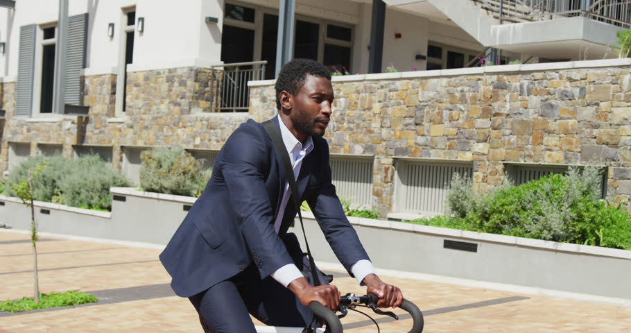 Animation of connections with data processing over african american businessman with bike. Global networks, business, finances, computing and data processing concept digitally generated video.