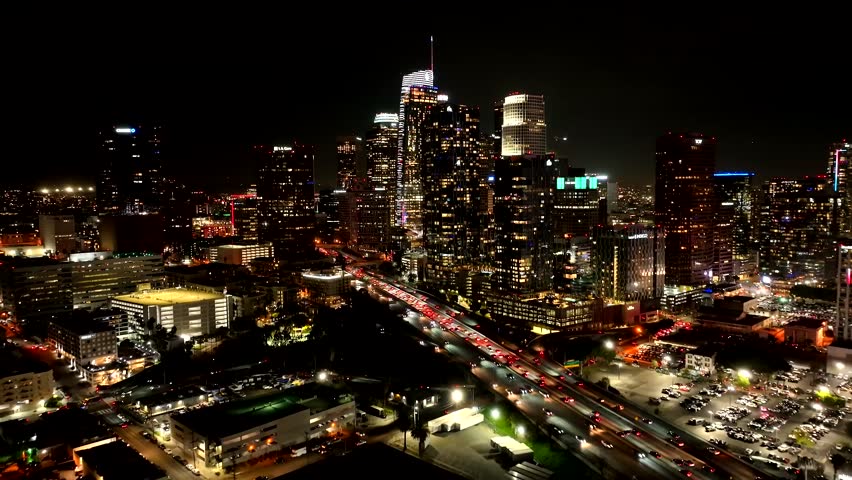 Establishing Aerial View, Downtown Los Angeles at Night, Lights on Buildings and Busy Traffic