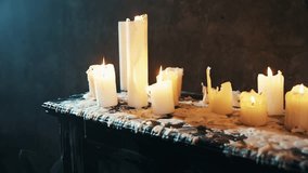 Dark gothic royal room black piano many white candles burning warm flame fire light melted wax flowing. Mystery background gray wall vintage old style. Horror atmosphere witch cult ritual. no people - Powered by Shutterstock - Get 15% off with code: PIKWIZARD15
