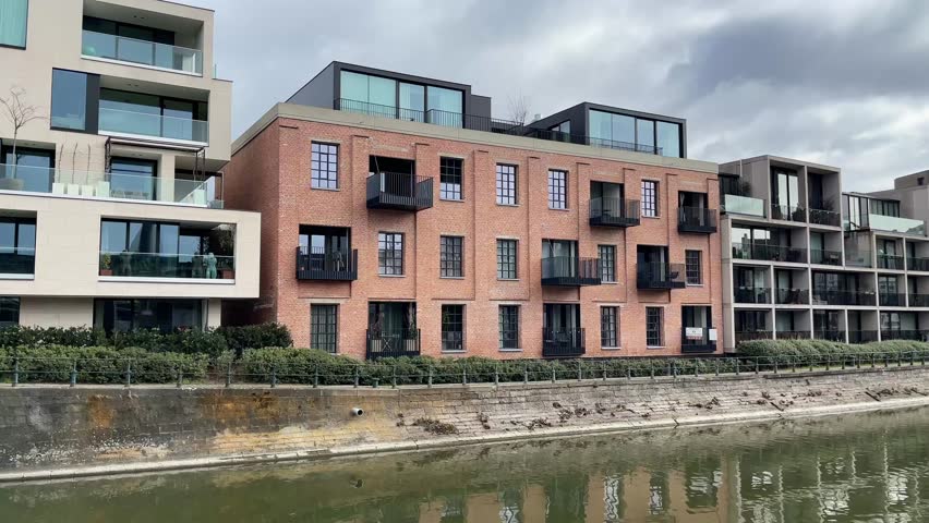 Modern residential buildings along the canal in Ghent, Belgium. High quality 4k footage