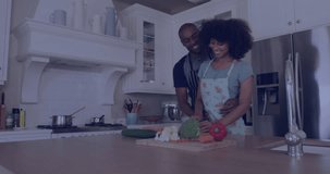 Animation of african american couple in love in kitchen and icons with data processing. Global lifestyle, computing, digital interface and data processing concept digitally generated video.