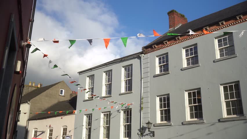 Small Irish colored flags crossing the street, Kilkenny, Ireland 4k
