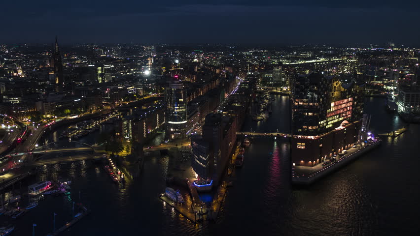 Establishing Aerial View Shot of Hamburg De, Mecklenburg-Western Pomerania, Germany, night, evening, superb quality, clear image, track right