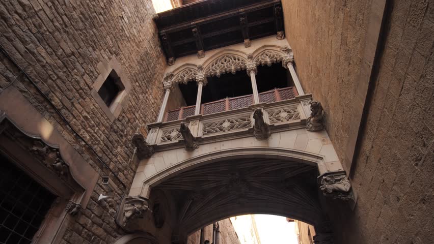 Pont del Bisbe and narrow street in Gothic Quarter in Barcelona. Spain. Royalty-Free Stock Footage #1101705493