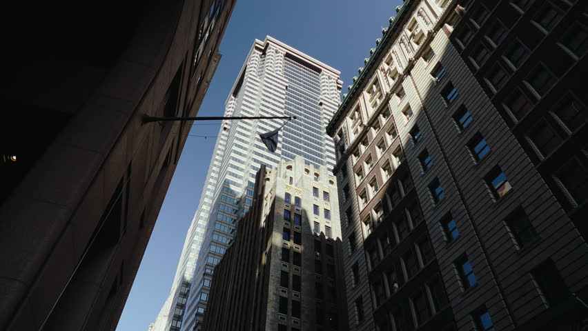 Tracking shot of tall buildings in New York, Financial district, Wall street
