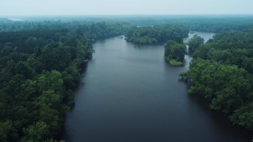 Wisconsin River aerial drone truck along on hazy summer day