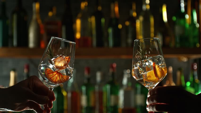Super Slow Motion Shot of Cheering with Two Drinks Before Bar at 1000fps. Royalty-Free Stock Footage #1101719857