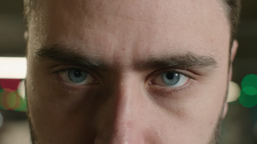 Close up male eyes strong sight angry unrecognizable man staring look at camera looking focused healthy eyesight ophthalmology clear eye vision blue eyeballs Caucasian guy face in details macro view