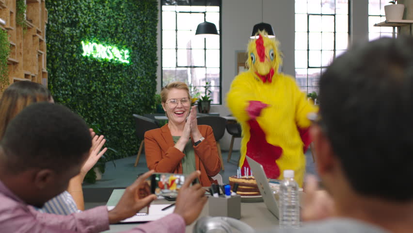 Dance, applause and business people with chicken mascot in office having fun. Business meeting, clapping or group of happy staff enjoying time with comic employee in costume dancing for prank or joke | Shutterstock HD Video #1101724653