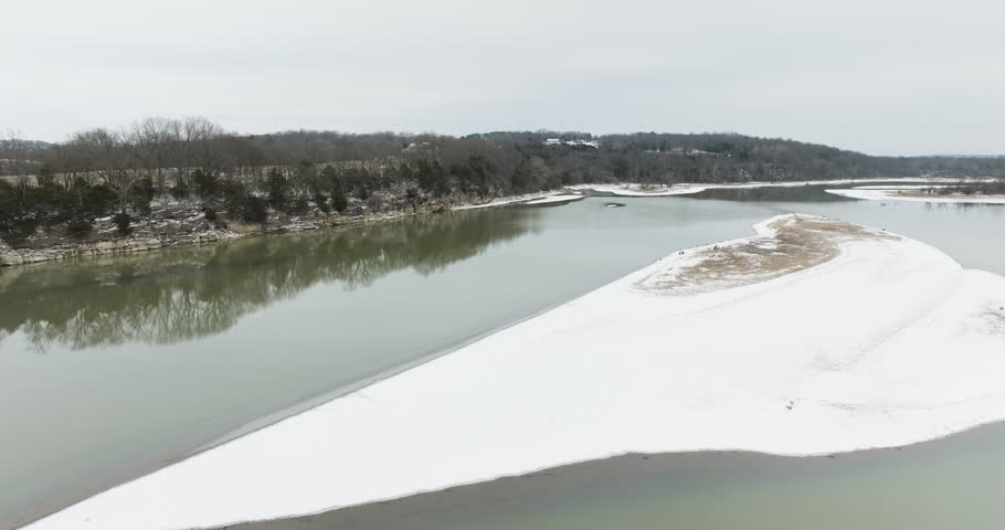 Flying Over The Tranquil Waters Of River In Daytime During Winter In Arkansas, USA. - aerial