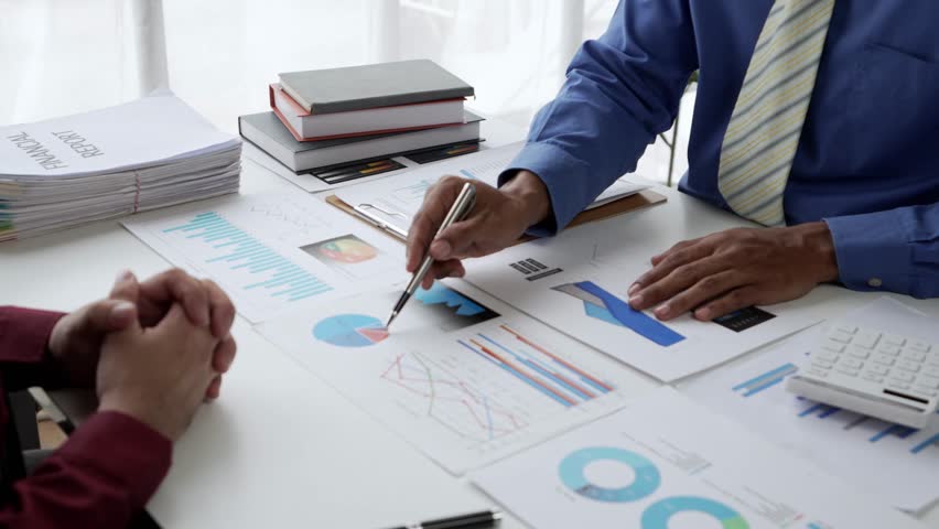 Group business people handshake at meeting table in office together with confident. Group businessman workers express agreement of investment deal.