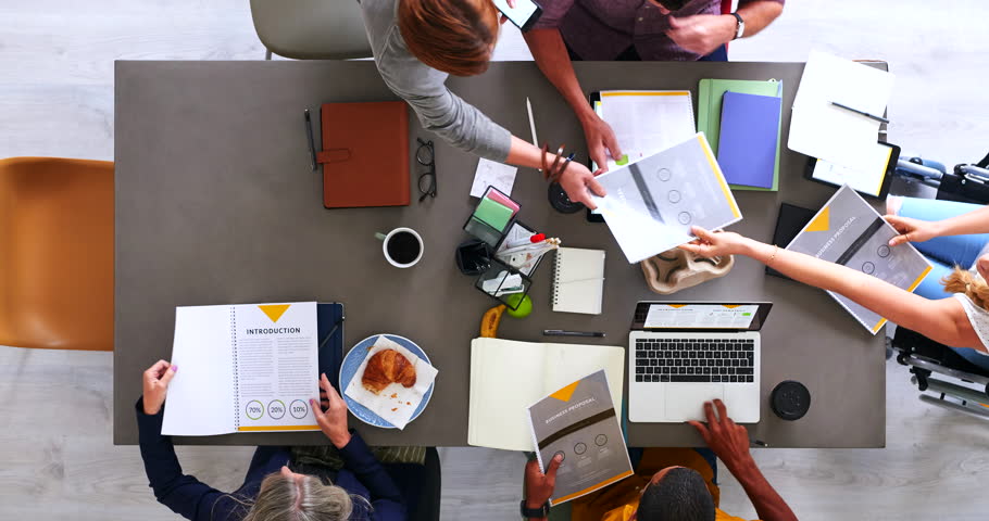 Top view of business meeting, marketing team and planning strategy for notes, vision or collaboration in startup. Timelapse of teamwork, brainstorming and creative ideas, goals and research on paper Royalty-Free Stock Footage #1101731173