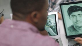 Facial recognition software, tablet and business people in meeting or engineers developing app for mobile technology. Teamwork, graphic designers and group in office sharing ideas and brainstorming. - Powered by Shutterstock - Get 15% off with code: PIKWIZARD15