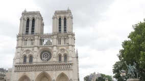 World wide recognizable Notre-Dame Cathedral located in France capital Paris 4K 2160p UltraHD footage - Famous Notre Dame de Paris church by the day 4K 3840X2160 UHD video