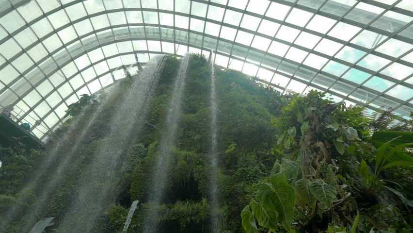 Cloud forest Gardens by the Bay Singapore main waterfall spinning shot Royalty-Free Stock Footage #1101736363