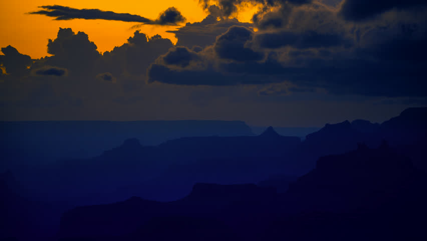 Magical dream clouds roil and churn above the Grand Canyon’s silhouetted plateaus and structural basins just after sunset.