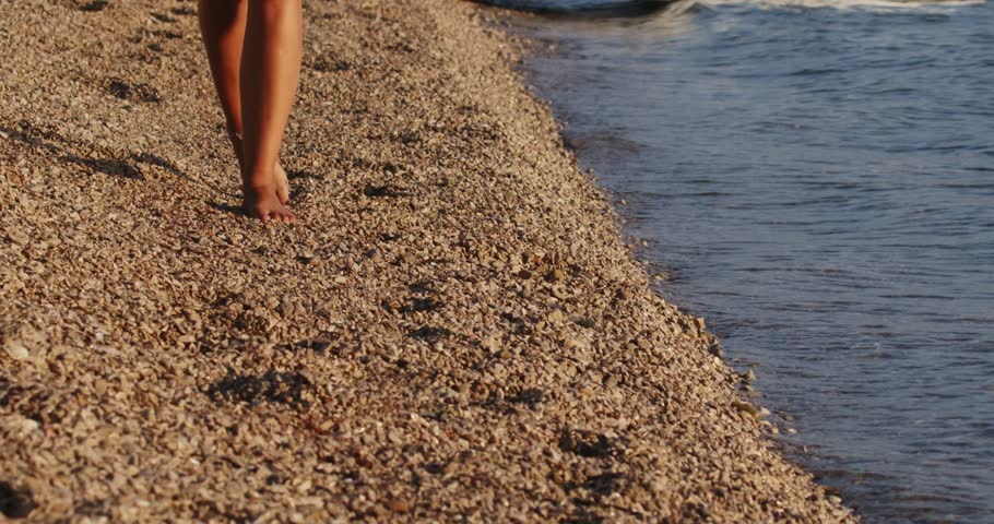 Girl is walking on a pebble beach on Peljesac peninsula, the Adriatic Sea in Croatia | Shutterstock HD Video #1101739625