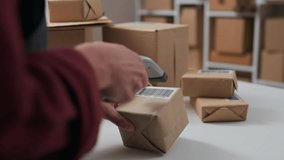 Entrepreneurial activity, worker Scans a barcode with an electronic scanner at the workplace of a packer, Warehouse worker works in a logistics center of progressive technologies of the future service - Powered by Shutterstock - Get 15% off with code: PIKWIZARD15
