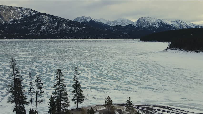 Abraham Lake top Cinematic Aerial view. 4K drone footage. Aerial View Of Abraham Lake With Calm Blue Waters In Alberta, Canada.
