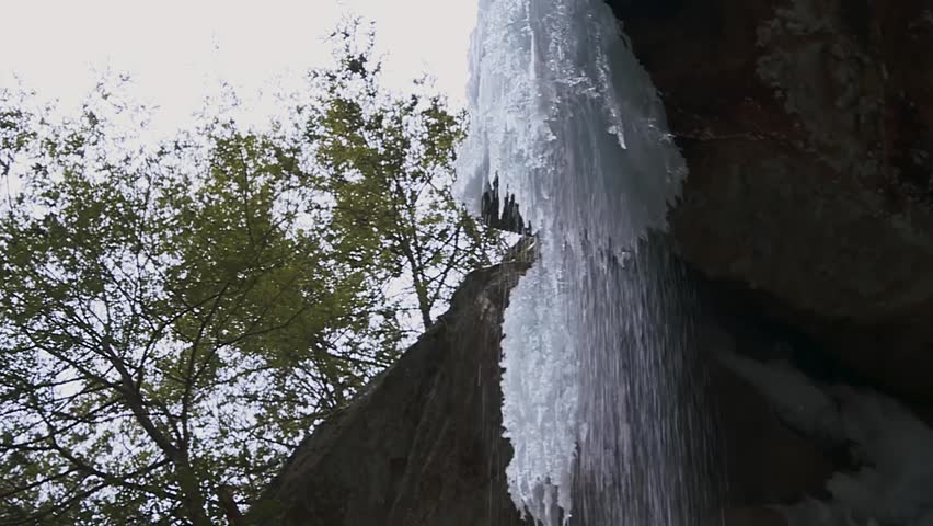 Cavern Mouth With Frozen Waterfall At Ash Cave In Hocking Hills State Park, South Bloomingville, Ohio. Low Angle, Sideways