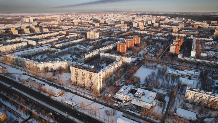 Aerial view. Winter panorama of the city of Tolyatti in the Samara region. Snow-covered streets of a provincial and industrial Russian city. Royalty-Free Stock Footage #1101747611