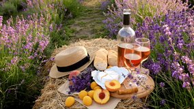 Picnic wine in a lavender field. Selective focus. Food. - Powered by Shutterstock - Get 15% off with code: PIKWIZARD15