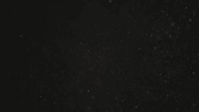 Slow motion real dust particles floating in the air with natural sunlight over black background - Powered by Shutterstock - Get 15% off with code: PIKWIZARD15