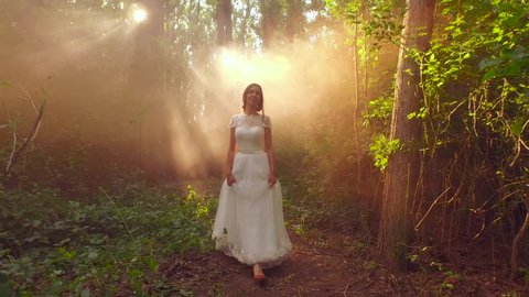 Fairy Tale Princess Bride Walking In Enchanted Forest Sunset Rays Bride White Dress Vintage Style Fashion Smiling Happy Beauty Nature Concept Stock-video