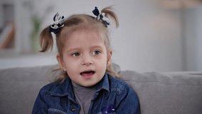 healthcare, caring female parent checks condition of little daughter throat because of a sore throat, little girl opens mouth and takes medicine for her illness