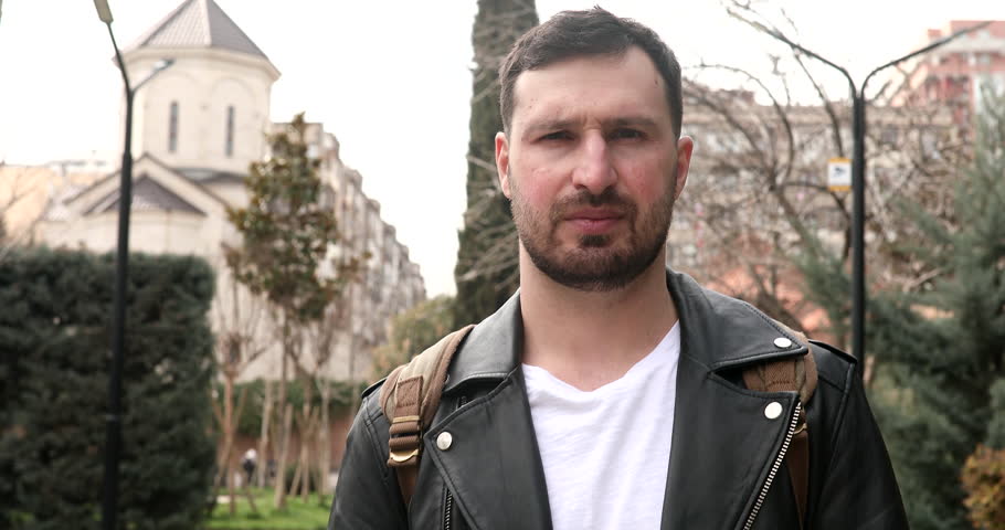 People lifestyle concept. Shrugging spreading arms on street. 