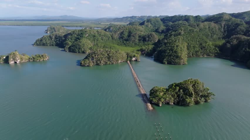 El parque Nacional Los Haitises Forest Islands In Dominican Republic. Aerial Pullback Shot