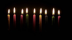 Colored Hanukkah Candles on black background. Close up shot - Powered by Shutterstock - Get 15% off with code: PIKWIZARD15