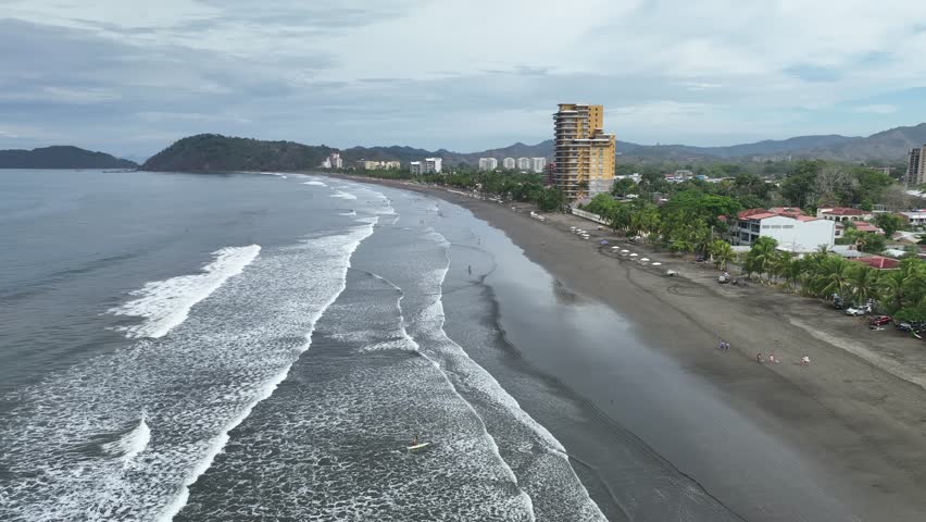 From above, Jaco Beach in Costa Rica is a stunning sight: white sands, blue waters, and lush greenery lining the shore.