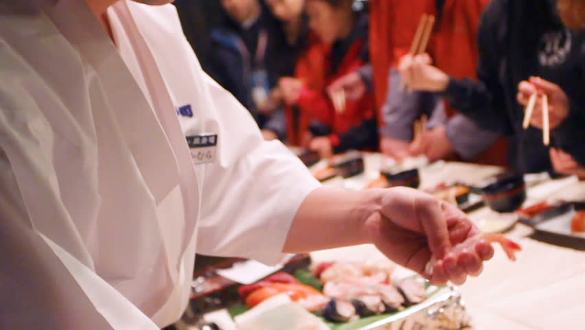 Chef making sushi sashimi nigiri. Master class. Professional chef is showing how to make sushi. Japanese food preparing process. Holding food in hands Royalty-Free Stock Footage #1101766969